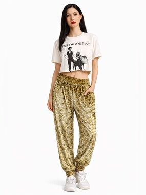 Anthropologie crushed velvet track pants in yellow green. XS